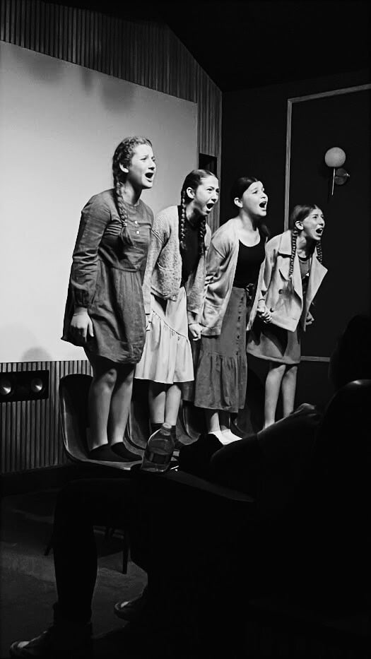 The cast of Never Forget on stage